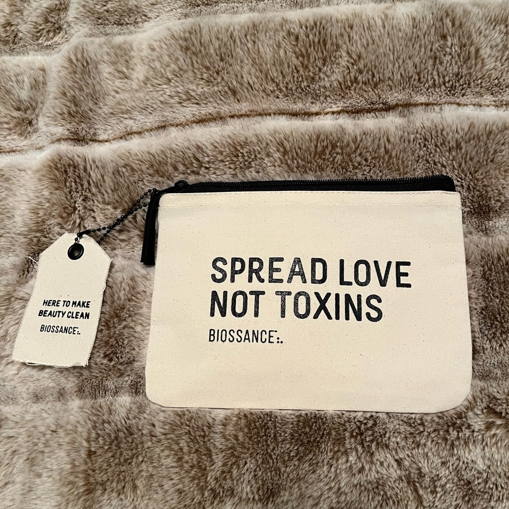 Biossance tan black zipper pouch with divider